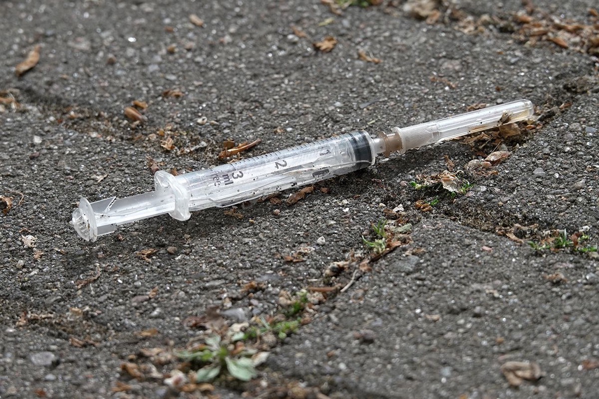 Drug needle on the side of the road